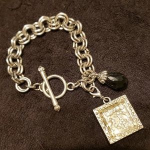 Chunky silver toned bracelet with Removable charm
